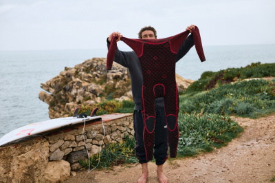 Surfer in a Quiksilver wetsuit with PrimaLoft Bio lining riding a wave
